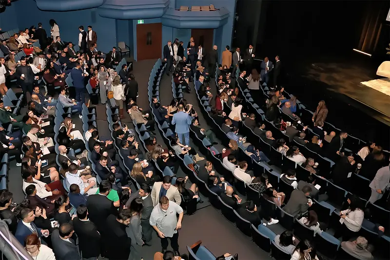 Every seat in the theatre taken, seen from above the stage